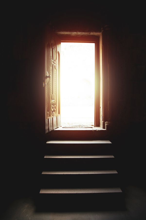 Ominous, illuminated open door